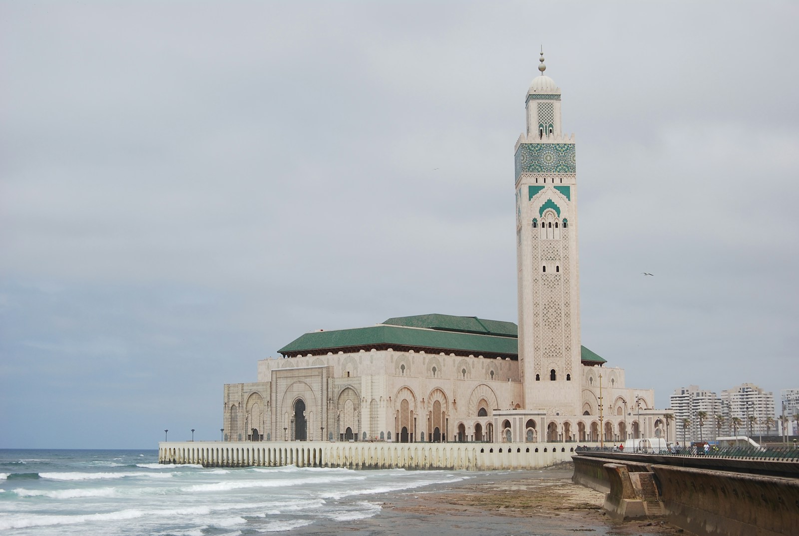 Hassan ii mosque on a cloudy day by the ocean